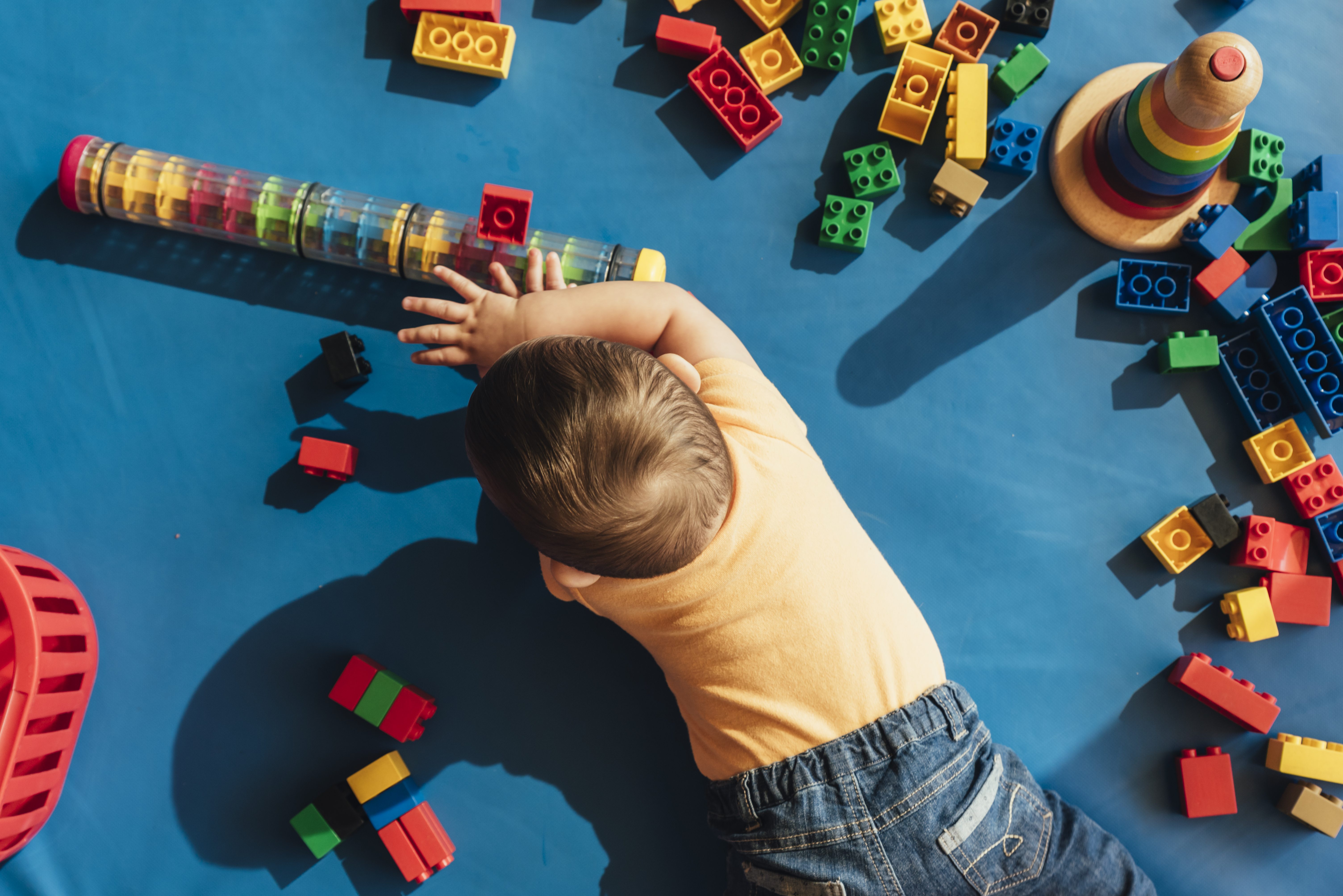 Child playing with toys. (Source: Envato)